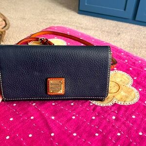 Clutch size Navy Blue Dooney & Burke slightly used red inside!